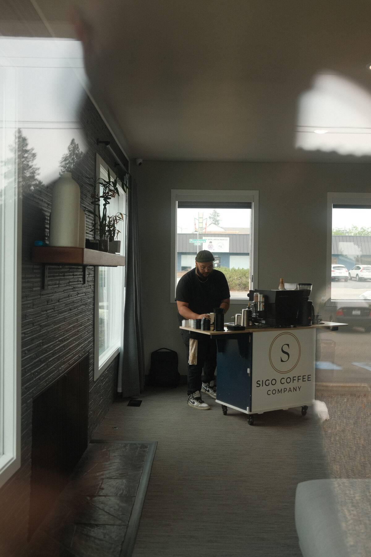 Nathan working the Sigo cart, the branded panel facing out into the room
